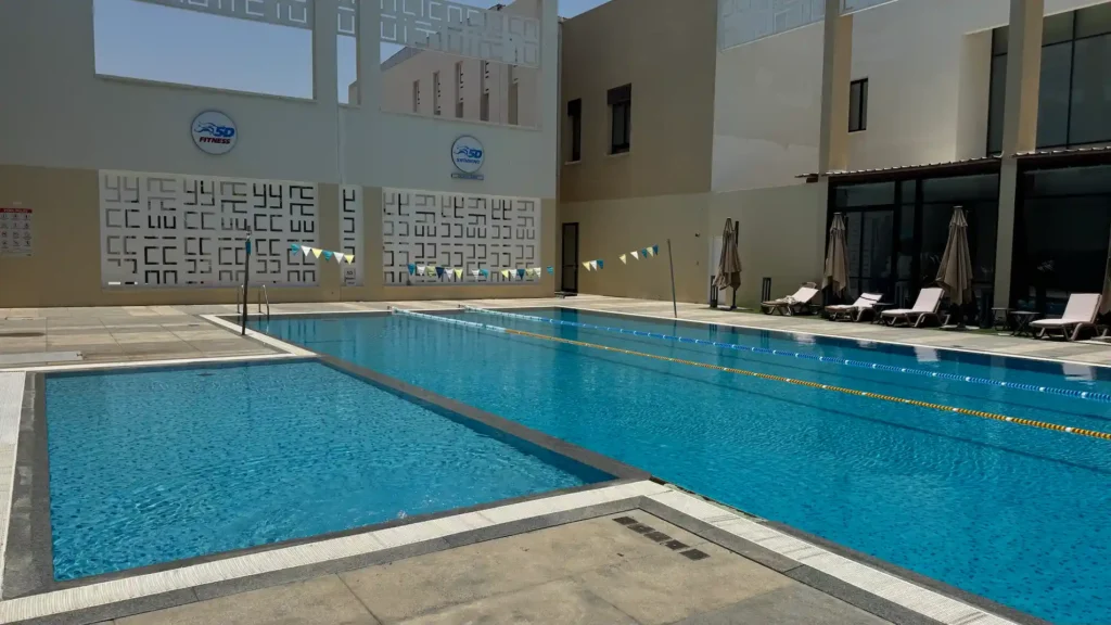 Outdoor swimming pool at 5D Fitness in Muscat, Oman with lane ropes for fitness swimming and training