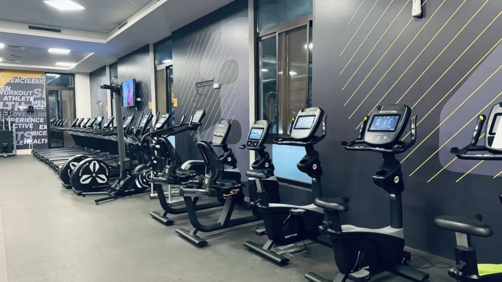 Cardio machines and fitness equipment in a modern gym in Muscat