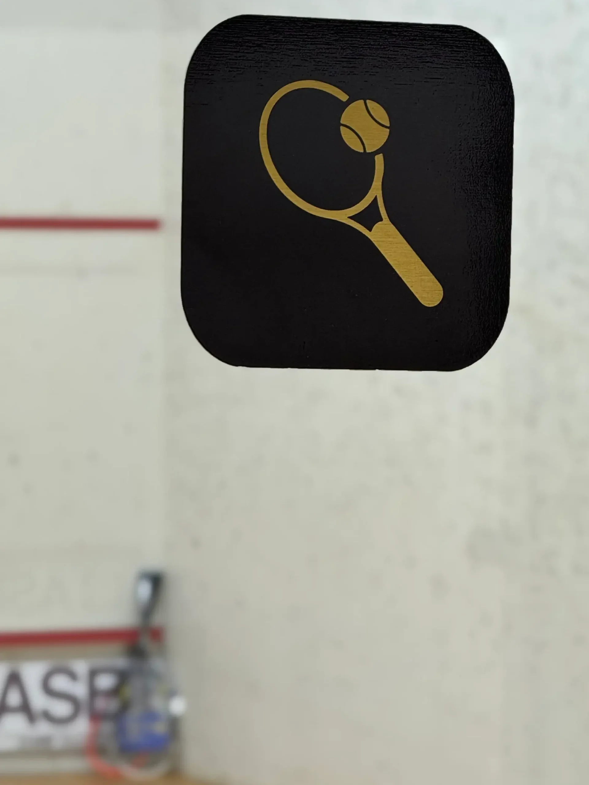 Squash court sign inside indoor sports facility in Muscat Oman