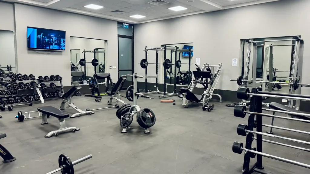 Strength training gym in Muscat with free weights and workout equipment